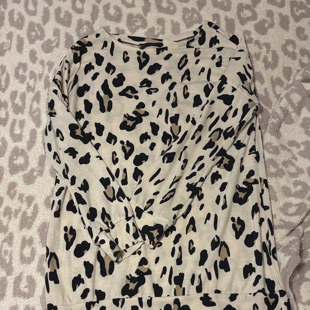 Tickled Teal Jaguar criss cross back top- size M